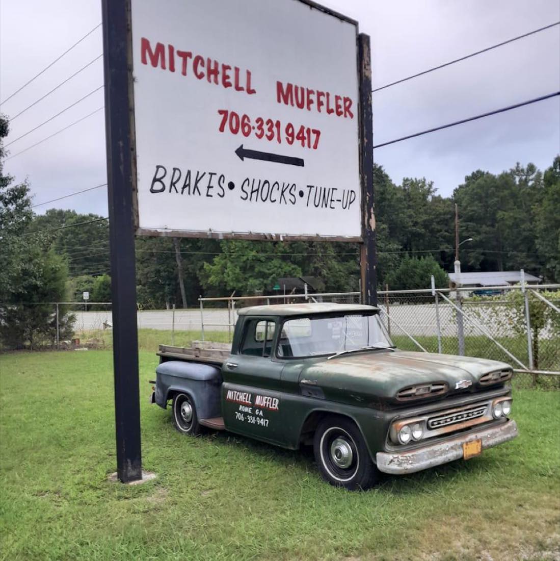 Mitchell Muffler & Auto Repair sign and shop truck
